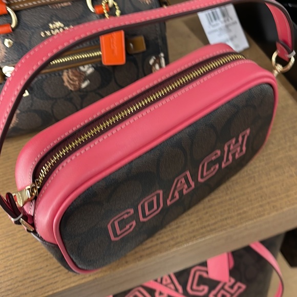 Coach Jamie Wristlet In Signature Canvas With Varsity Motif
IM/Brown/Watermelon - Picture 9 of 16